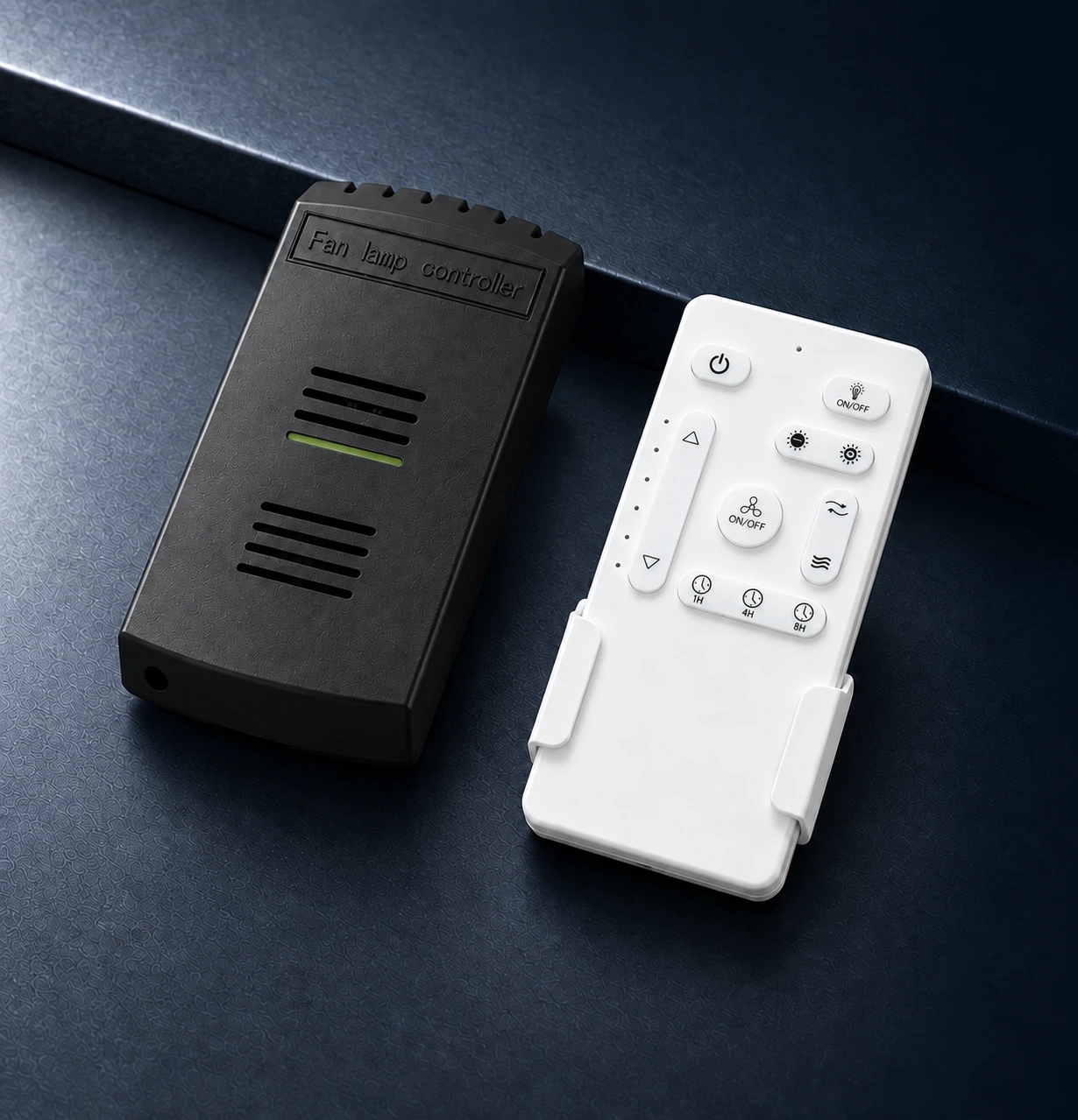DC ceiling fan receiver and remote control on a graphite surface
